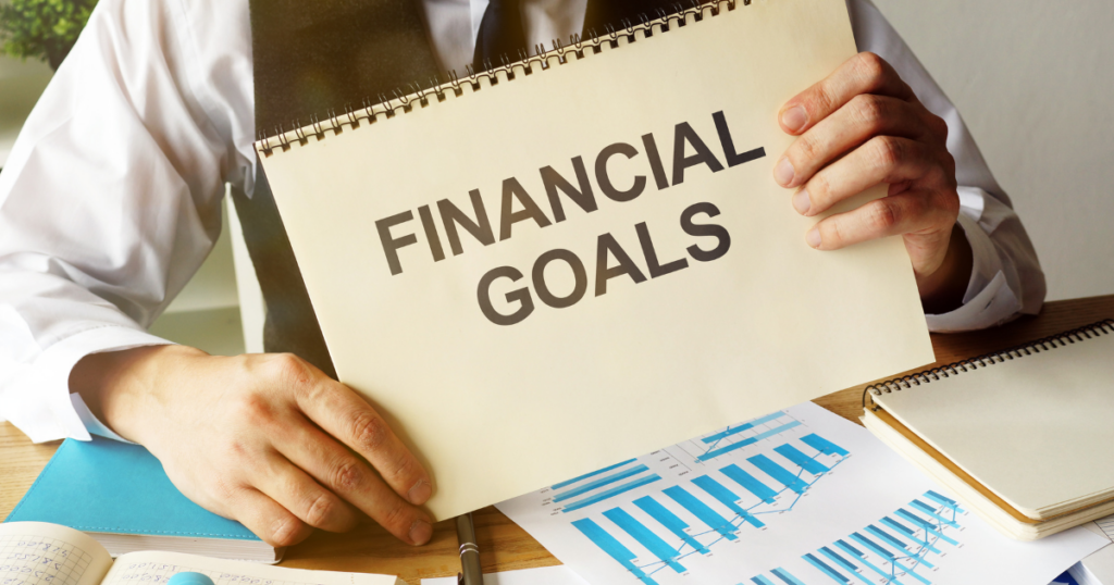 blog-post-pics-1024x538-10 man holding a financial goals sign