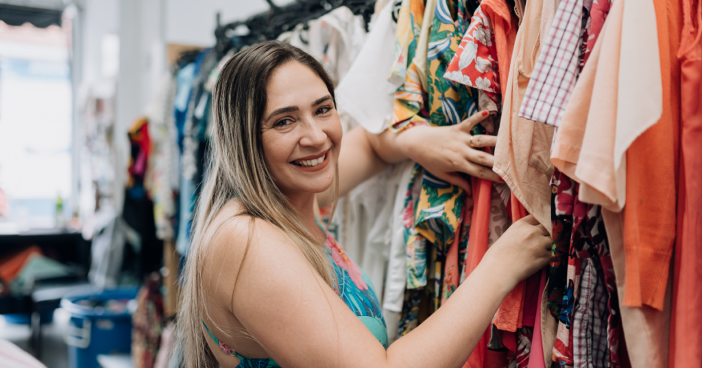 blog-post-pics-1024x538-6 girl looking at clothes in a thrift store