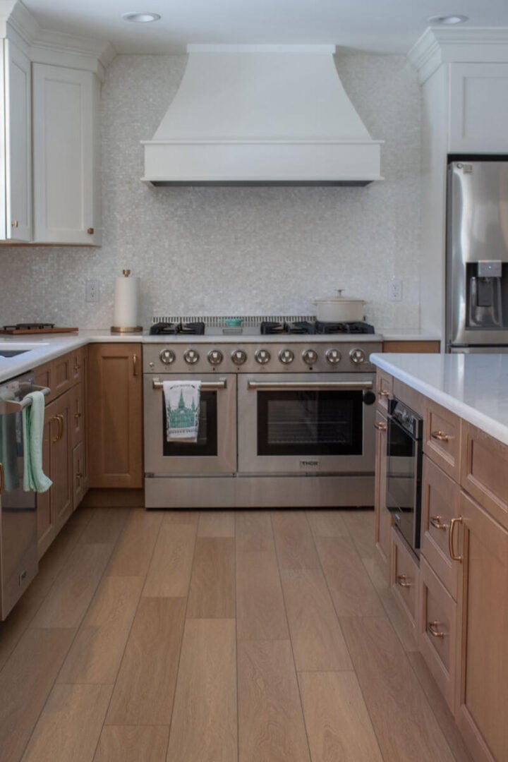range-hood-curved-style-in-modern-kitchen-720x1080-1 range-hood-curved-style-in-modern-kitchen - white and brown kitchen cabinets ideas