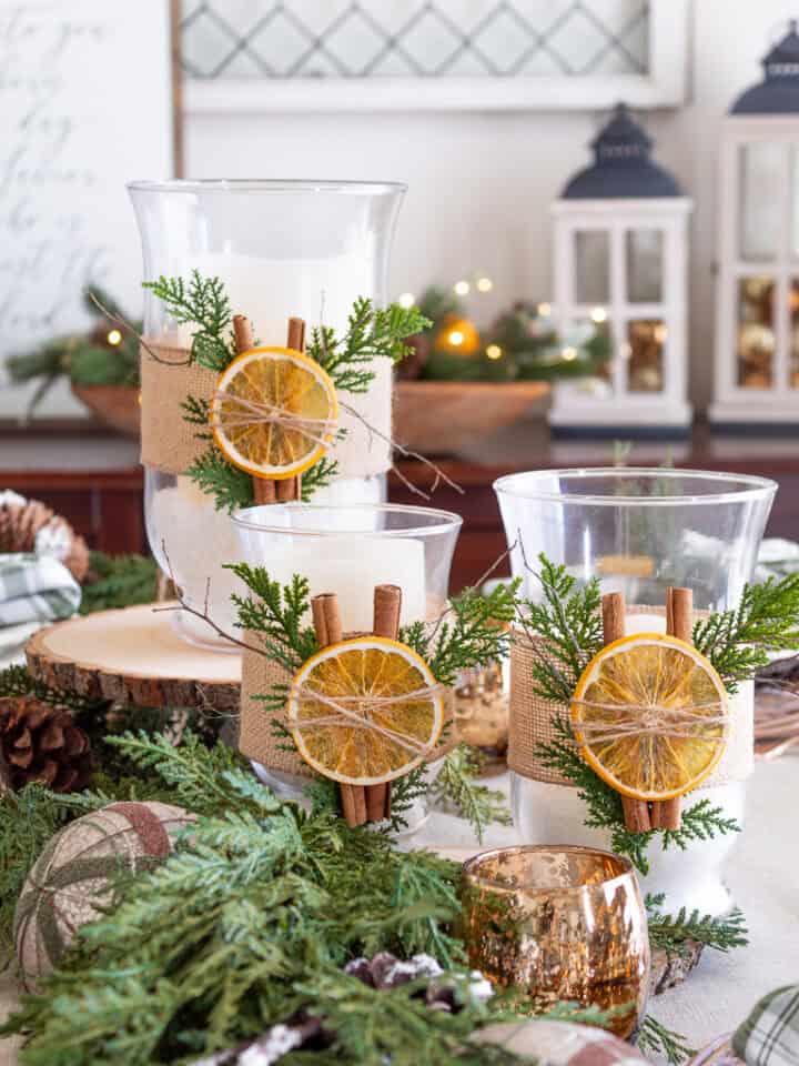 pretty Christmas centerpiece with candles and dried fruit